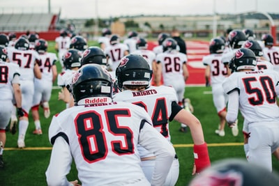 football players in white jersey shirt